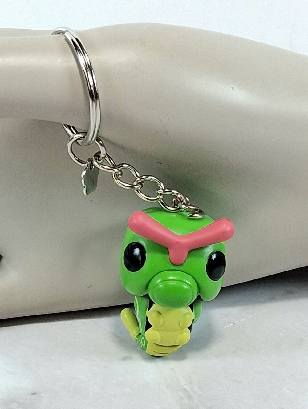 Repurposed Green and Yellow Caterpie Toy Into A Keychain